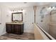 Bathroom features a double vanity, tile backsplash, and glass-enclosed shower at 320 Westgrove Ct, Durham, NC 27703