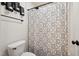 Modern bathroom with patterned shower curtain and white toilet at 320 Westgrove Ct, Durham, NC 27703