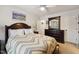 Bedroom featuring neutral walls, picture of Wrigley Field, and a dark-stained dresser at 320 Westgrove Ct, Durham, NC 27703