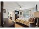 Comfortable bedroom featuring a ceiling fan, and television with a large window at 320 Westgrove Ct, Durham, NC 27703