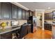 Kitchen with built-in computer desk and stainless steel appliances at 320 Westgrove Ct, Durham, NC 27703