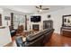 Cozy living room with a fireplace, large TV, and comfortable seating at 320 Westgrove Ct, Durham, NC 27703