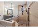 Modern shower with glass enclosure, pebble floor, and mounted shower head at 320 Westgrove Ct, Durham, NC 27703