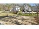 View of level backyard, homes, and surrounding neighborhood at 3304 Cheswick Dr, Raleigh, NC 27609