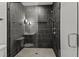 Stylish bathroom with a gray tiled shower, modern fixtures, and glass enclosure at 3304 Cheswick Dr, Raleigh, NC 27609