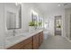 Bright bathroom with double vanity, soaking tub, and a separate shower, offering a luxurious spa-like experience at 3304 Cheswick Dr, Raleigh, NC 27609