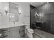 Contemporary bathroom featuring sleek vanity, modern fixtures, and tiled walk-in shower at 3304 Cheswick Dr, Raleigh, NC 27609