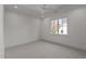 Bright and spacious bedroom with neutral carpet, white ceiling fan, and large window at 3304 Cheswick Dr, Raleigh, NC 27609