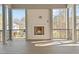 A cozy outdoor fireplace with wood mantel in a large, covered back deck at 3304 Cheswick Dr, Raleigh, NC 27609