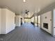 A large covered deck featuring an outdoor fireplace and fan, ideal for relaxing outdoors at 3304 Cheswick Dr, Raleigh, NC 27609