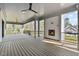 Large back deck with ceiling fans and a beautiful outdoor fireplace for cozy evenings at 3304 Cheswick Dr, Raleigh, NC 27609