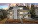 Stunning two-story home featuring modern design, black trim windows, second story balconies, and manicured landscaping at 3304 Cheswick Dr, Raleigh, NC 27609