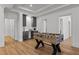 Game room featuring a foosball table, wet bar, recessed lighting, and hardwood floors at 3304 Cheswick Dr, Raleigh, NC 27609