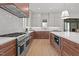 Beautiful kitchen featuring stainless steel appliances, custom cabinets, and a large island at 3304 Cheswick Dr, Raleigh, NC 27609