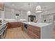 Spacious kitchen featuring pendant lights, a large island, and stainless steel appliances at 3304 Cheswick Dr, Raleigh, NC 27609