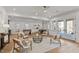 Bright living room featuring hardwood floors, recessed lighting, ceiling fan, and stylish neutral decor with comfortable seating at 3304 Cheswick Dr, Raleigh, NC 27609