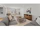 Comfortable living room with large sectional, stylish coffee table, and backyard views at 3304 Cheswick Dr, Raleigh, NC 27609