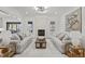 Spacious living room with fireplace, two sofas, wooden coffee table, and contemporary decor at 3304 Cheswick Dr, Raleigh, NC 27609