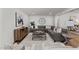 Spacious living area featuring a large sectional sofa and stylish decor at 3304 Cheswick Dr, Raleigh, NC 27609