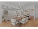 Open living space with dining area, bar, living room with fireplace, and lots of natural light at 3304 Cheswick Dr, Raleigh, NC 27609