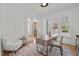 Bright home office with modern furniture, large windows, and view of the front yard at 3304 Cheswick Dr, Raleigh, NC 27609