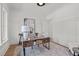 Bright office space with natural light, modern desk, and stylish decor with plank accent wall at 3304 Cheswick Dr, Raleigh, NC 27609