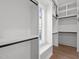 Bright walk-in closet with custom shelving, storage, window, and bench at 3304 Cheswick Dr, Raleigh, NC 27609