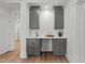 Well-appointed wet bar with gray cabinets, white countertops, and stylish fixtures in a neutral-toned space at 3304 Cheswick Dr, Raleigh, NC 27609