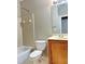 Clean bathroom with a tub, toilet and wooden vanity at 331 Providence Glen Dr, Chapel Hill, NC 27514