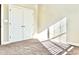 Well-lit bedroom featuring a double door closet and carpet flooring at 331 Providence Glen Dr, Chapel Hill, NC 27514