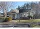 Community center with a covered entrance and landscaping at 331 Providence Glen Dr, Chapel Hill, NC 27514
