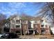 Brick building exterior with multiple units and ample parking at 331 Providence Glen Dr, Chapel Hill, NC 27514