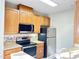 Modern kitchen features stainless steel appliances and light wood cabinets at 331 Providence Glen Dr, Chapel Hill, NC 27514