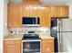 Modern kitchen with stainless steel appliances and wood cabinets at 331 Providence Glen Dr, Chapel Hill, NC 27514