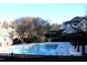 Community swimming pool with surrounding deck and trees at 331 Providence Glen Dr, Chapel Hill, NC 27514