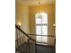 Upper floor landing with large window and chandelier at 331 Providence Glen Dr, Chapel Hill, NC 27514