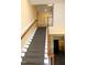 Indoor stairway with carpeted steps and wooden railings at 331 Providence Glen Dr, Chapel Hill, NC 27514