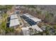 Aerial view of townhome community nestled in a wooded area at 4015 Southpoint Lndg Way, Durham, NC 27707