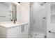 Modern bathroom with white vanity, quartz countertop, and glass shower at 4015 Southpoint Lndg Way, Durham, NC 27707