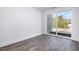 Bedroom with wood-look floors and access to private balcony at 4015 Southpoint Lndg Way, Durham, NC 27707