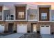Modern three-unit townhome development with attached garages and private balconies at 4015 Southpoint Lndg Way, Durham, NC 27707