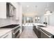 Modern kitchen with stainless steel appliances and marble countertops at 4015 Southpoint Lndg Way, Durham, NC 27707