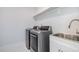 Convenient laundry room with washer, dryer, and utility sink at 4015 Southpoint Lndg Way, Durham, NC 27707
