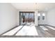 Sunlit living room featuring hardwood floors and access to backyard deck at 4015 Southpoint Lndg Way, Durham, NC 27707