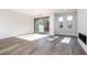 Bright living room with hardwood floors, fireplace, and sliding glass doors to deck at 4015 Southpoint Lndg Way, Durham, NC 27707