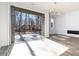 Bright living area with sliding doors opening to a deck and wooded backyard at 4015 Southpoint Lndg Way, Durham, NC 27707