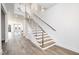 Modern staircase with wood treads and metal railing at 4015 Southpoint Lndg Way, Durham, NC 27707