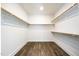 Large walk-in closet with ample shelving at 4015 Southpoint Lndg Way, Durham, NC 27707