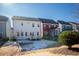 View of backyard with deck and neighboring houses at 512 Beacon Ridge Blvd, Chapel Hill, NC 27516