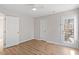 Bedroom with window, door to outside and ceiling fan at 526 Pierce Ave, Wake Forest, NC 27587